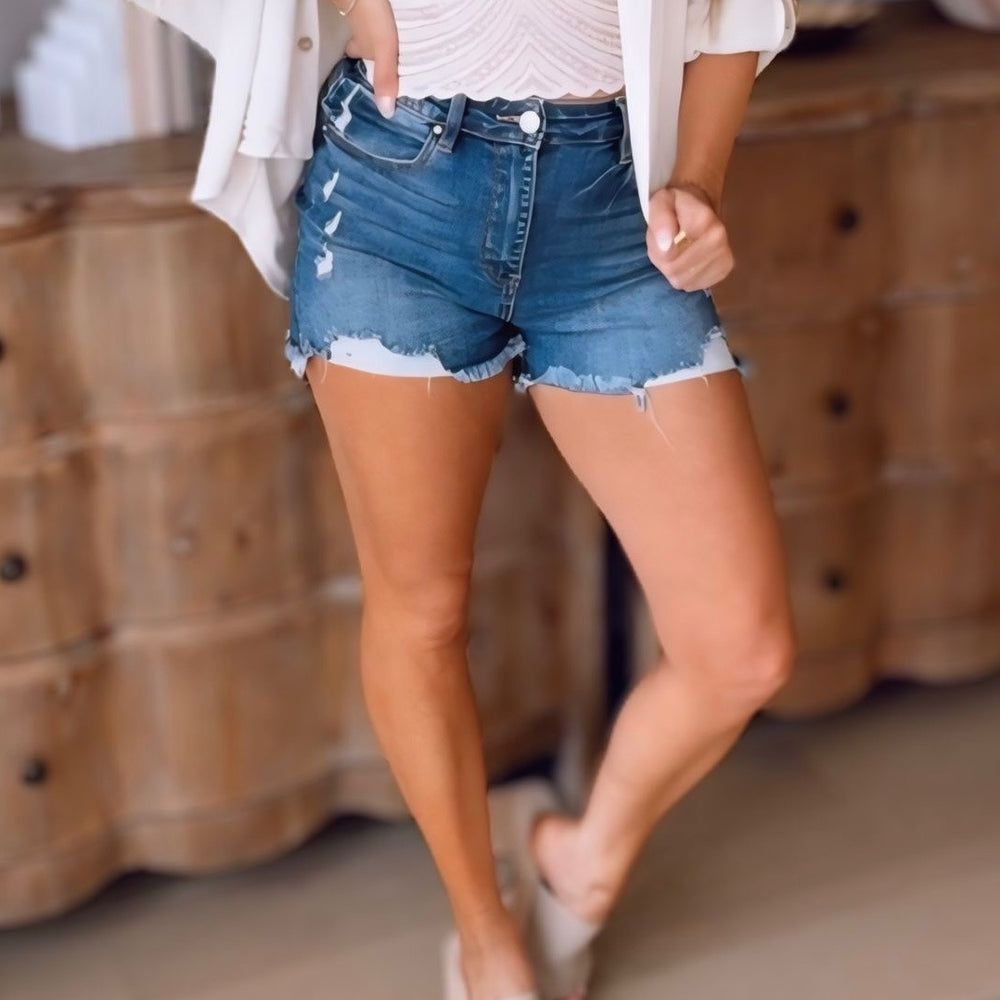 
                      
                        Risen - High Rise Distressed Shorts in Dark Wash
                      
                    